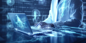 Clinician using a computer, generating ideas.