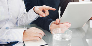Two people in a meeting.