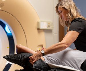 SecureVac bag being shaped around patient for cancer treatment by Radiation Therapist.
